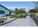 Spacious deck and backyard featuring a gazebo and landscaping at 8742 Bermuda Ln, Port Richey, FL 34668