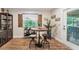 Breakfast nook with seating for three, wooden shutters, and a sliding glass door to the patio at 8742 Bermuda Ln, Port Richey, FL 34668