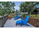 Back deck with lounge chairs and a view of the lawn and surrounding properties at 8742 Bermuda Ln, Port Richey, FL 34668