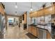 The kitchen boasts stainless steel appliances, dark countertops, and seamlessly connects to the dining area at 8742 Bermuda Ln, Port Richey, FL 34668