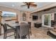 Cozy lanai with an outdoor seating area, TV, and views of the backyard at 8742 Bermuda Ln, Port Richey, FL 34668