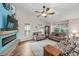 Open living room with a vaulted ceiling, luxury vinyl floors, and a decorative fireplace at 8742 Bermuda Ln, Port Richey, FL 34668