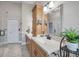 Bright bathroom featuring double sinks, modern fixtures, and a separate glass enclosed shower at 8742 Bermuda Ln, Port Richey, FL 34668