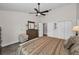 Comfortable main bedroom featuring a ceiling fan, neutral color palette, and spacious closets at 8742 Bermuda Ln, Port Richey, FL 34668