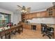 Bright home office with custom cabinets, built in desk, and an abundance of natural light at 8742 Bermuda Ln, Port Richey, FL 34668