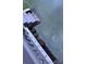 Back yard water access with stairs and gray-colored railings at 8742 Bermuda Ln, Port Richey, FL 34668