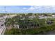 Exterior view of apartment buildings, framed by mature trees near a roadway at 9001 Tudor Dr # H210, Tampa, FL 33615