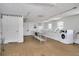 Community laundry room with multiple washers and dryers and a folding table at 9001 Tudor Dr # H210, Tampa, FL 33615