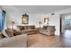 Comfortable living room boasts hardwood floors, cozy seating, and natural light at 9001 Tudor Dr # H210, Tampa, FL 33615