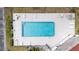 Aerial view of the clean community pool with chairs and tables at 9001 Tudor Dr # H210, Tampa, FL 33615