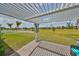 Backyard patio with comfortable seating and a spacious lawn perfect for outdoor enjoyment at 933 Signet Dr, Apollo Beach, FL 33572