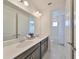 Double vanity bathroom with modern fixtures and a separate shower and toilet area at 933 Signet Dr, Apollo Beach, FL 33572