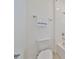 Clean bathroom featuring a white toilet, bathtub and shower combination, and towel rack at 933 Signet Dr, Apollo Beach, FL 33572