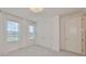 Bright bedroom with double closet, neutral carpet, and sheer window curtains at 933 Signet Dr, Apollo Beach, FL 33572