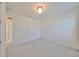 Spacious bedroom featuring neutral carpet, white walls, and entry to another room at 933 Signet Dr, Apollo Beach, FL 33572