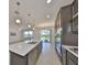 Bright, open kitchen with a large island and stainless steel appliances at 933 Signet Dr, Apollo Beach, FL 33572