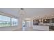 Open-concept living space featuring tile floors, neutral walls, and backyard view at 933 Signet Dr, Apollo Beach, FL 33572
