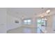 Open-concept living space with tile floors and backyard view at 933 Signet Dr, Apollo Beach, FL 33572