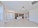 Open-concept living area featuring tile floors, large windows, and a modern kitchen at 933 Signet Dr, Apollo Beach, FL 33572