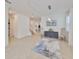 Bright living room with neutral decor, tile floors, and stylish furniture arrangement at 933 Signet Dr, Apollo Beach, FL 33572