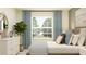 Inviting bedroom showcasing a comfortable bed, modern dresser, and serene decor, providing a restful and stylish environment at 9344 Cannon Beach Dr, Parrish, FL 34219