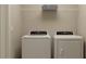 Functional laundry area with a modern washer and dryer set, offering convenience and efficiency for everyday chores at 9344 Cannon Beach Dr, Parrish, FL 34219
