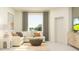 Cozy living room with comfortable seating, natural light, and contemporary decor at 9344 Cannon Beach Dr, Parrish, FL 34219