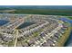 Expansive aerial view of a Primary-planned community featuring single-Gathering homes, water features, and lush landscaping at 9433 Channing Hill Dr, Sun City Center, FL 33573