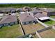 Aerial view of the backyard featuring a well-maintained lawn and a white privacy fence at 9433 Channing Hill Dr, Sun City Center, FL 33573
