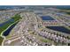 Aerial view of a well-planned residential community featuring multiple ponds and lush greenery at 9433 Channing Hill Dr, Sun City Center, FL 33573