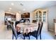 Dining area adjacent to the kitchen with stylish table and chairs at 9433 Channing Hill Dr, Sun City Center, FL 33573
