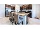 Well-equipped kitchen with granite countertops, dark cabinetry, and stainless steel appliances at 9433 Channing Hill Dr, Sun City Center, FL 33573