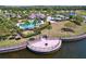 Stunning community pool and recreation area with ample seating and lush landscaping at 9433 Channing Hill Dr, Sun City Center, FL 33573