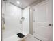 Modern glass shower with stylish fixtures and a convenient door to the outside at 9433 Channing Hill Dr, Sun City Center, FL 33573