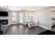 Spacious living room with a fireplace, dining table, and access to bedroom at 1000 W Horatio St # 207, Tampa, FL 33606