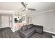 Open floor plan with modern kitchen, fireplace and a comfortable gray couch at 1000 W Horatio St # 207, Tampa, FL 33606
