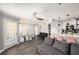 Open floor plan with comfortable gray couch, washer/dryer, kitchen, and dining at 1000 W Horatio St # 207, Tampa, FL 33606