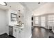Open-concept living room with modern kitchen, fireplace, and lots of natural light at 1000 W Horatio St # 207, Tampa, FL 33606