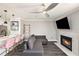 Cozy living room featuring a fireplace, television, and a comfortable couch at 1000 W Horatio St # 207, Tampa, FL 33606
