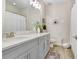 This bathroom boasts a double vanity, stylish mirrors, and modern fixtures at 10703 Morning Dew Way, Tampa, FL 33647
