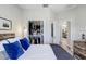 Bedroom view showcasing a walk-in closet with organized shelving, complemented by stylish decor and light-filled spaces at 10703 Morning Dew Way, Tampa, FL 33647