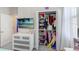 Bright bedroom displays a dresser, closet with ample shelving, and a TV mounted on the wall, creating a cozy retreat at 10703 Morning Dew Way, Tampa, FL 33647