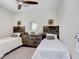 This is a lovely decorated bedroom with twin beds and a matching dresser at 10703 Morning Dew Way, Tampa, FL 33647
