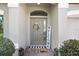 Inviting front entrance adorned with a welcome sign and a decorative wreath on the door at 10703 Morning Dew Way, Tampa, FL 33647