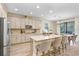 Open kitchen featuring a spacious island, stainless steel appliances, and stylish countertops at 10703 Morning Dew Way, Tampa, FL 33647