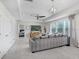 This living room is spacious and features natural lighting and modern decor at 10703 Morning Dew Way, Tampa, FL 33647