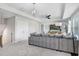 Spacious living room features plush sofa, tray ceilings and ample natural light at 10703 Morning Dew Way, Tampa, FL 33647