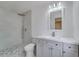 Modern bathroom with walk-in shower, pebble floor and sleek vanity at 11480 Genter Dr, Spring Hill, FL 34609