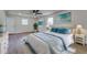 Bright bedroom with stylish decor, comfortable bed, and serene ocean-themed artwork at 11480 Genter Dr, Spring Hill, FL 34609