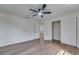 This bedroom features wood-look floors and a closet at 11480 Genter Dr, Spring Hill, FL 34609